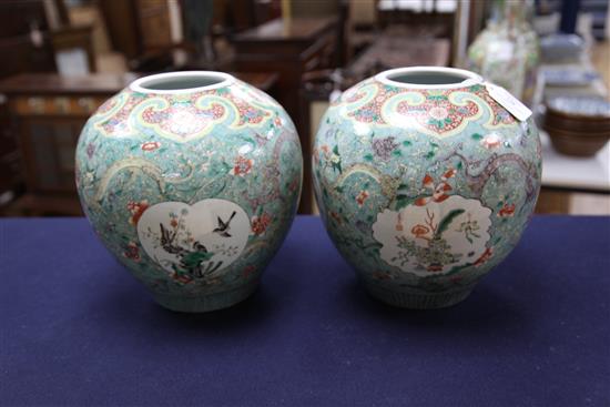 A pair of Chinese famille verte ovoid jars and covers, late 19th century, 31cm, one cover repaired